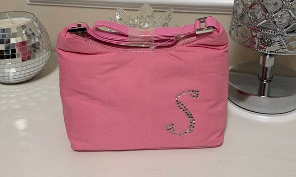 Bag - This bag is a stylish and functional small bag/case made of pink fabric