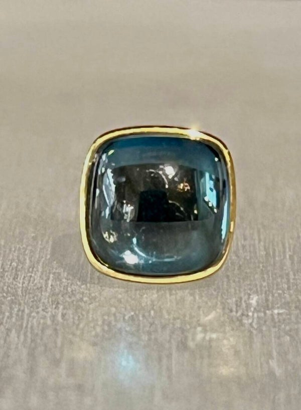 Kopje van blauw-topaas in geel goud, ES unica