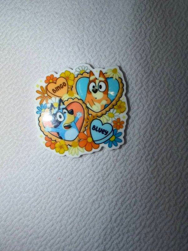 Bluey and Bingo with flowers