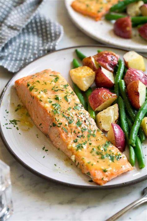 Salmon with herbs served with green beans and potatoes