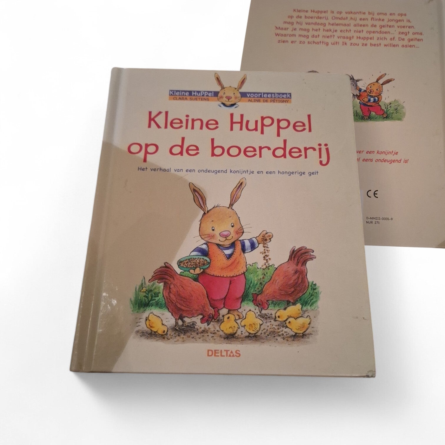 Kinder lees boek Kleine Huppel op de boerderij