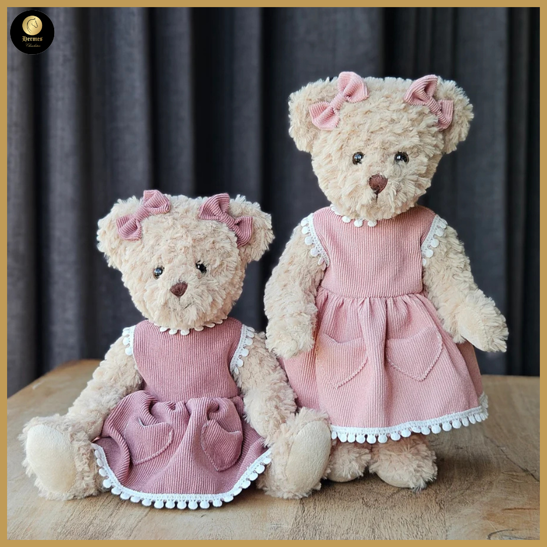 Meisjesbeer 30cm met  roze of terra cotta jurkje