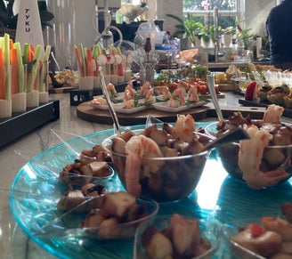 octopus salad, served on a tasting spoon. in the backround other great looking Hors D’oeuvres