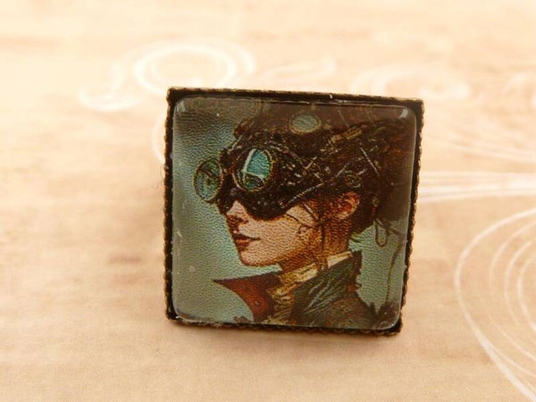 Eckiger Ring mit  Steampunk Mädchen türkis bronzefarben