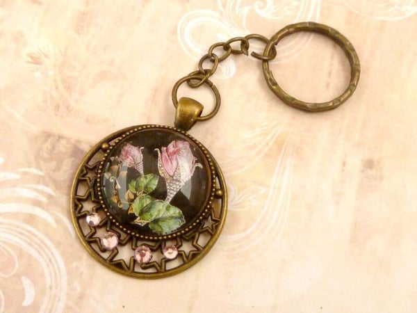 Edler Schlüsselanhänger mit Juwelenrose und Stern Ornamenten rosa bronzefarben