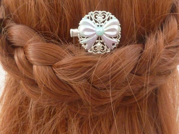 Runder Haarclip im Kawaii Stil mit Schleife rosa türkis silberfarben