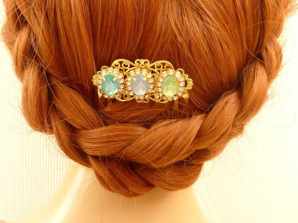 Funkelnder Haarkamm in goldfarben mit drei facettierten Schmucksteinen