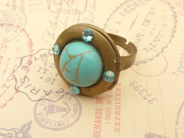 Edelstein Medaillon Ring mit Türkis Cabochon Foto Ring mit türkisfarbenem Strass