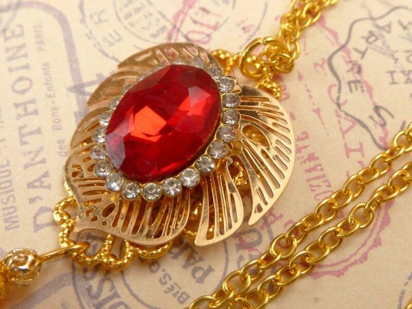 Festliche Halskette mit Blatt Ornament und rotem Glasjuwel goldfarben