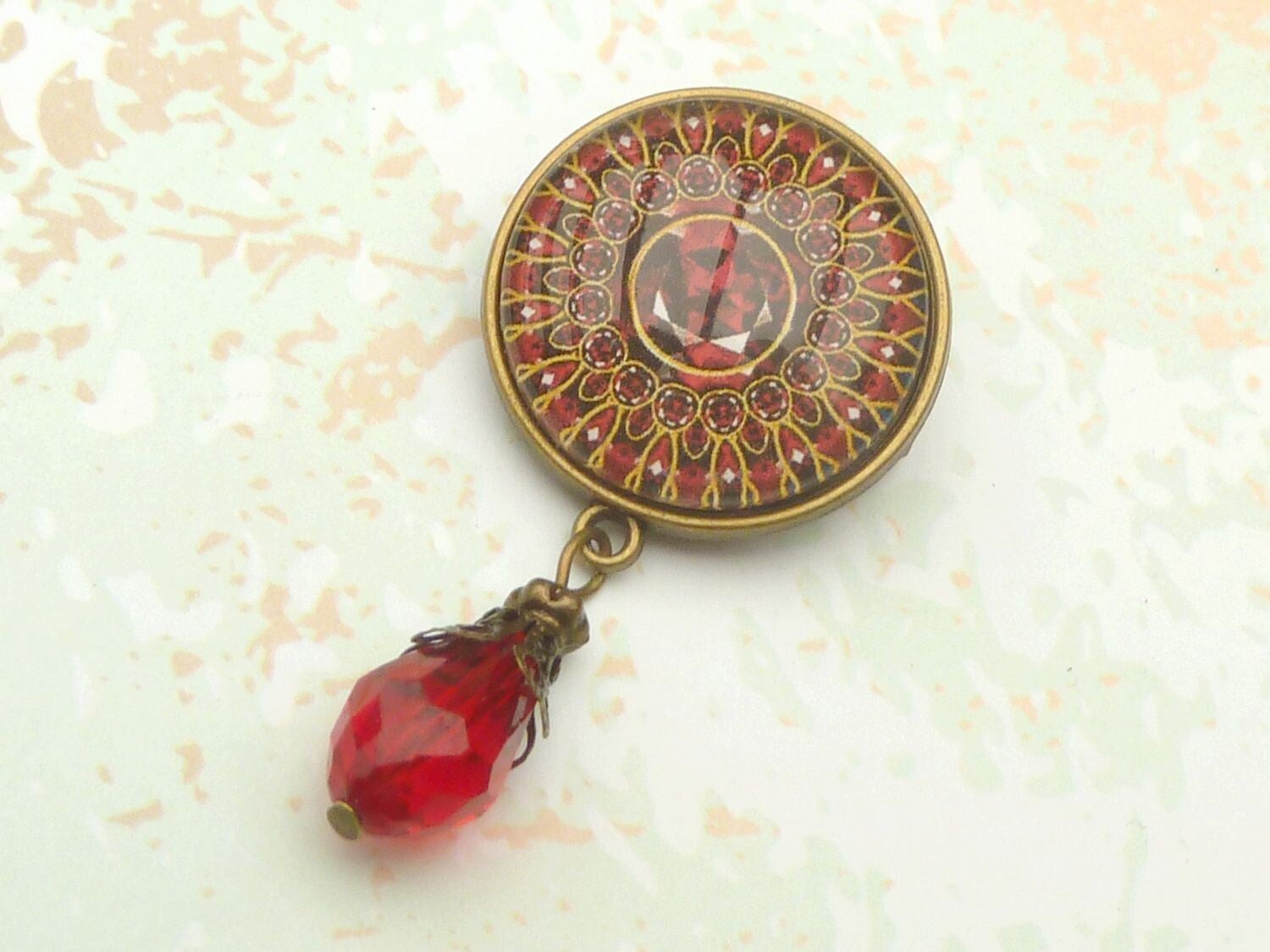 Runde Brosche mit Juwelen Motiv rot bronzefarben Dekolletéschmuck
