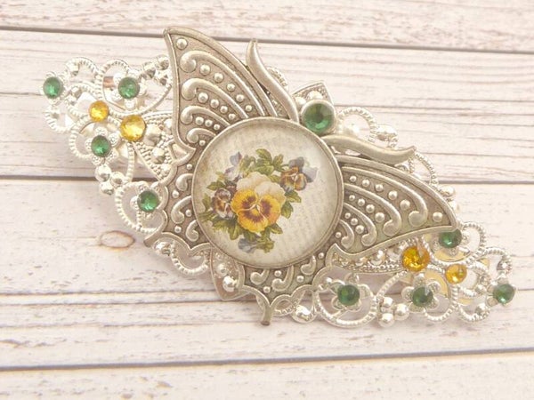 Haarspange mit Schmetterling Ornament und Stiefmütterchen Motiv silberfarben