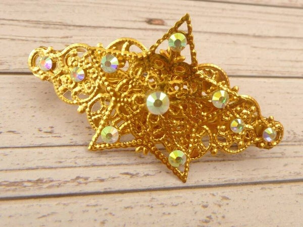 Kleine Haarspange mit Stern Ornament goldfarben mit Kristallen in klar AB