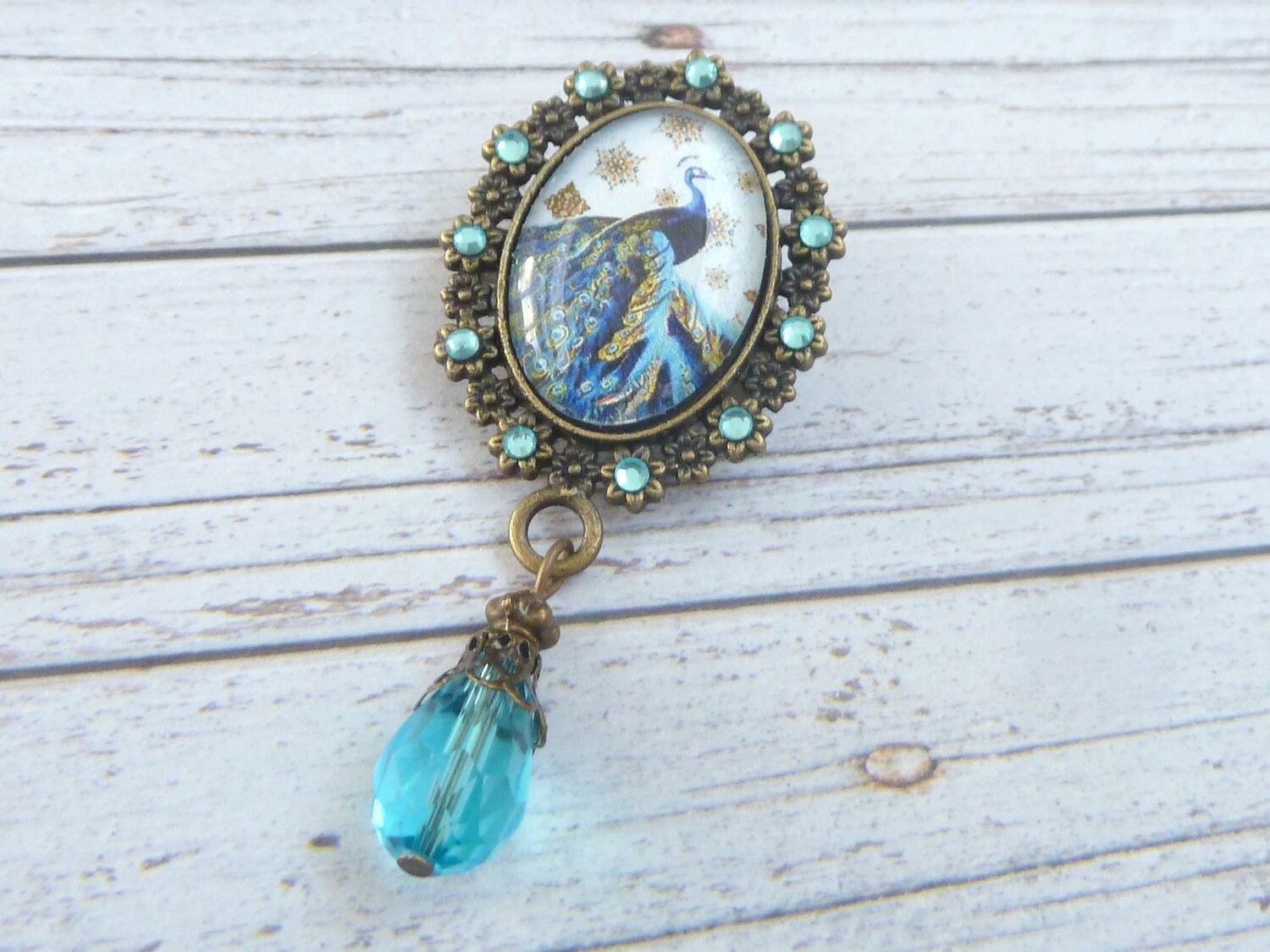Brosche im Jugendstil Design mit Pfau Motiv türkis bronzefarben