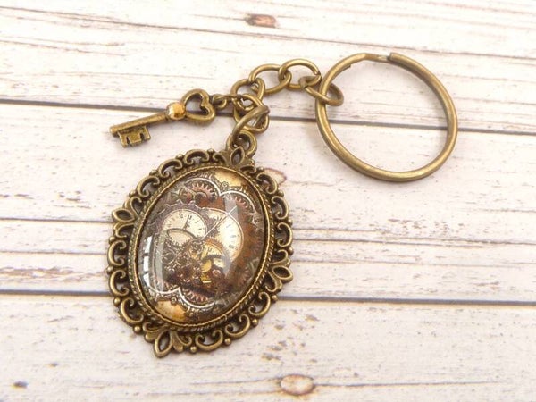 Edler Schlüsselanhänger mit Steampunk Motiv  Zahnräder Uhren bronzefarben