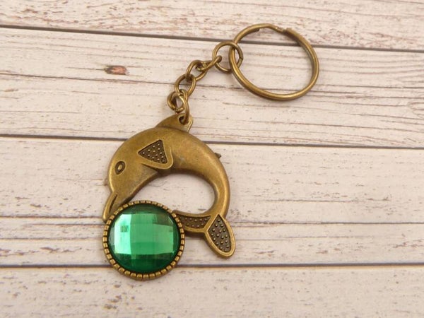 Maritimer Schlüsselanhänger mit Delfin Motiv und Schmuckstein bronzefarben