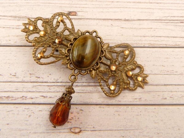 Edelstein Haarclip in Schleifenform mit Tigerauge Cabochon bronzefarben