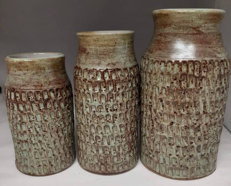 Photo of a 3 piece carved vase set