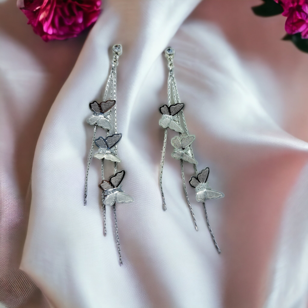 Platinum plated long butterfly stud earrings