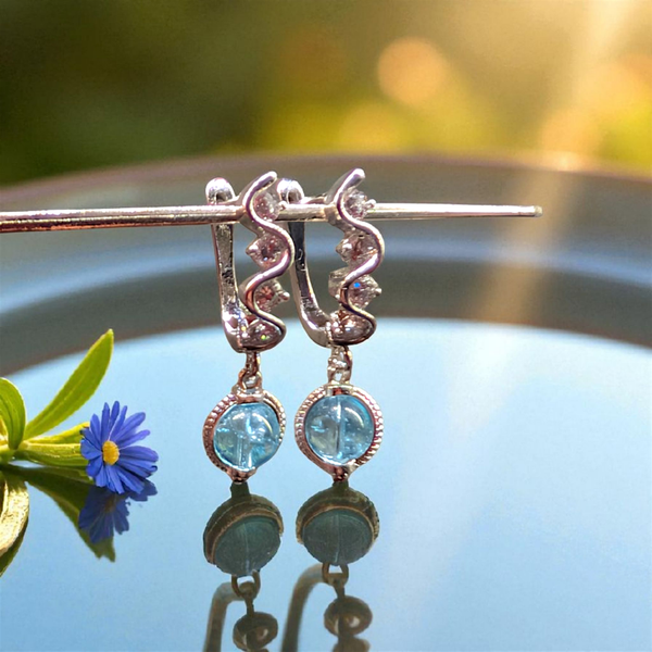 Sterling silver dangle earrings with topaz beads