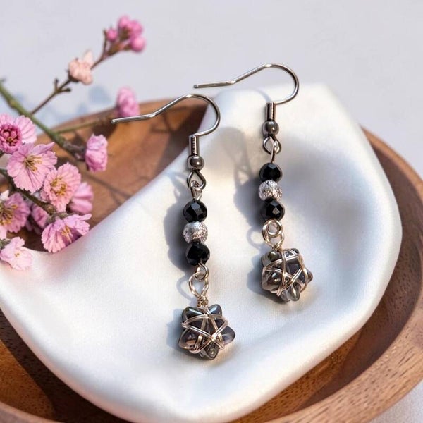 Handmade earrings with silver wire wrapped crystal star charm and black spinel beads