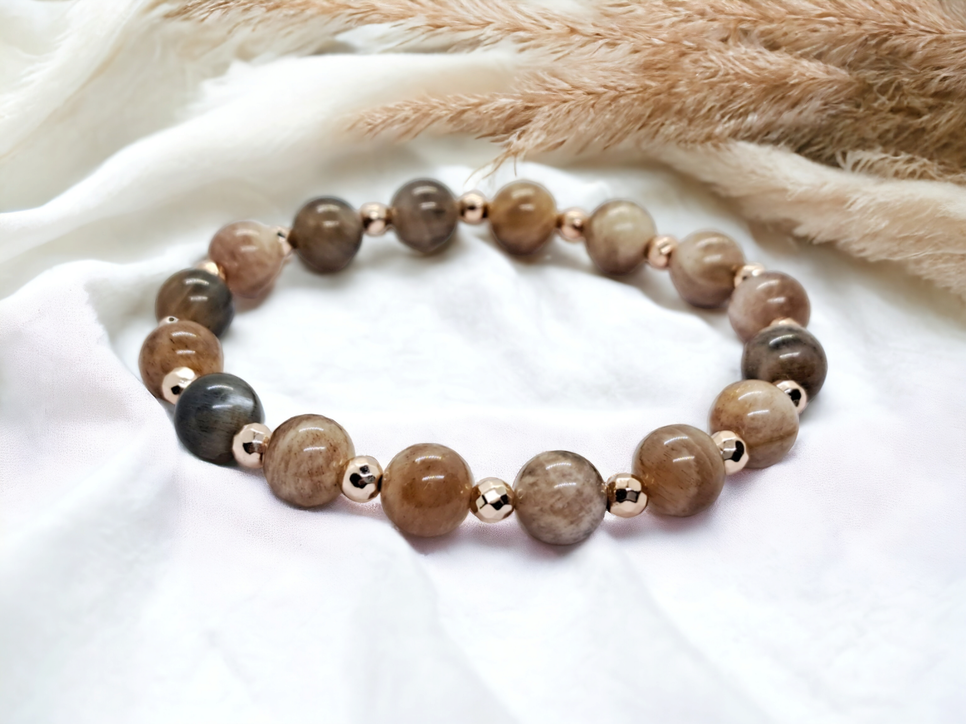 Natural black moonstone 8mm beads bracelet with rose gold plated hematite beads.