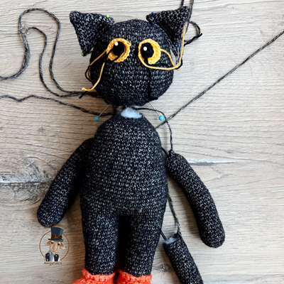Sewing a crocheted cat