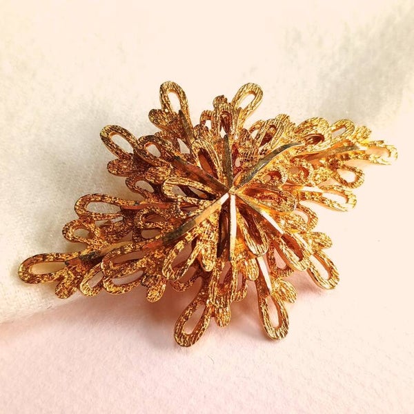 Vergulde fantasie broche 60s
