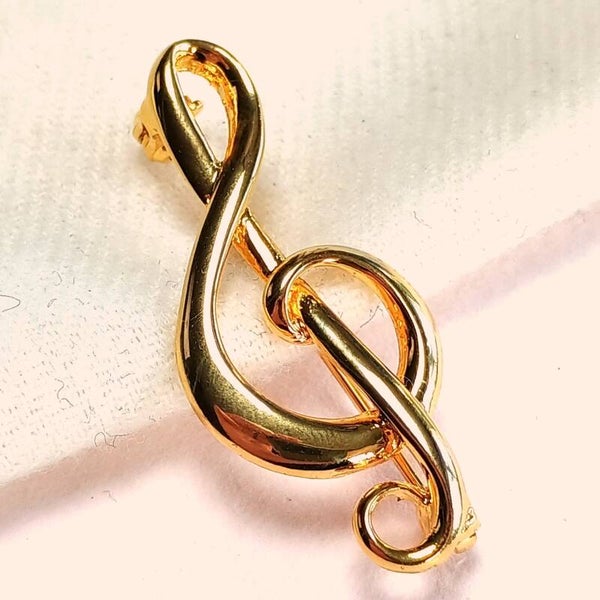Goudkleurige muzieksleutel broche 80s