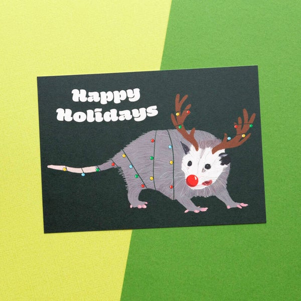 Kerstkaart: Ollie de Opossum