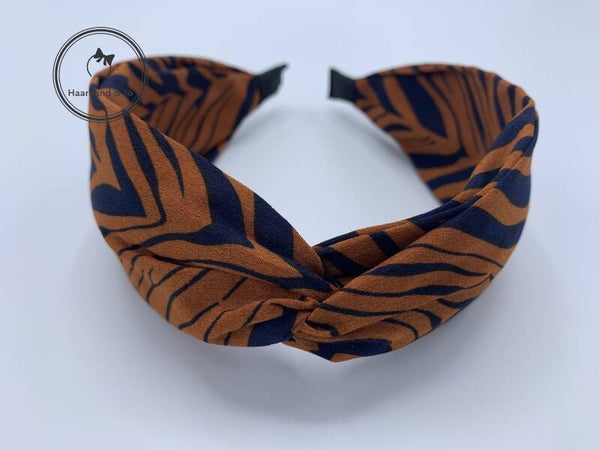 Brede booghaarband met twist in zebramotief, roest/donkerblauw (art. nr. 105-07)