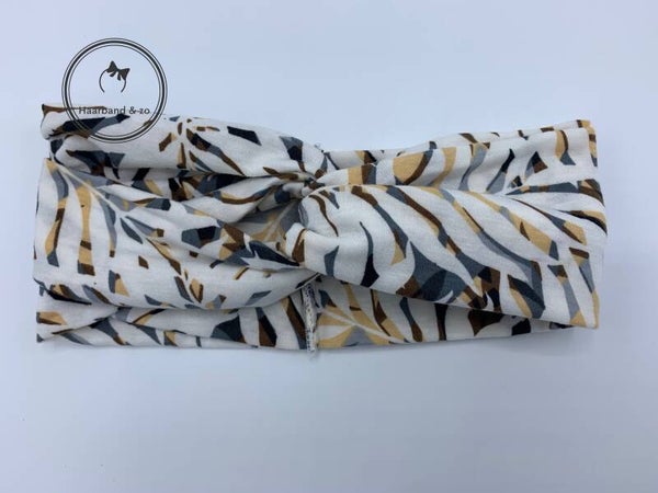 Soepele elastische haarband met twist in tricot, wit met grijs/beige bloemenprint (art.nr. 105-09)
