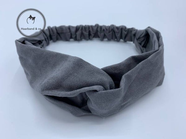Elastische haarband met twist in suedelook, grijs. (art.nr. 122-01)