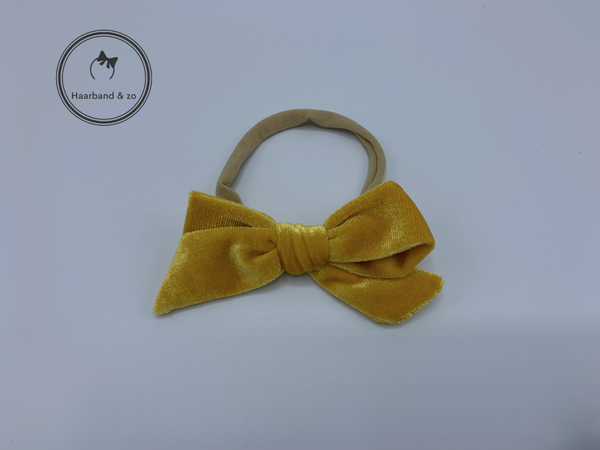 Nylon baby haarbandje met fluwelen strik, okergeel (art.nr 136-05)