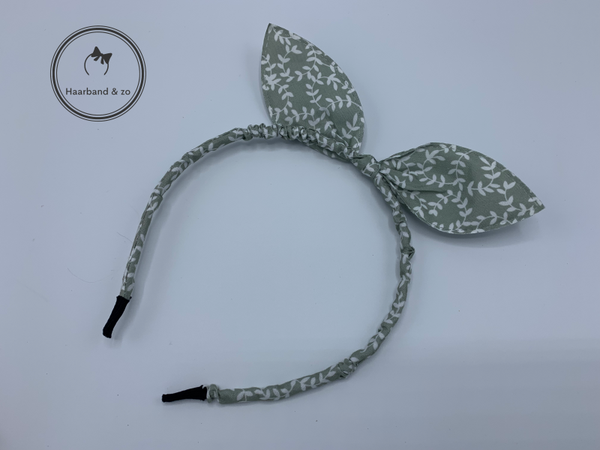 Kinder booghaarband van stof met strik in bloemetjespatroon, steengroen (art.nr. 17-12