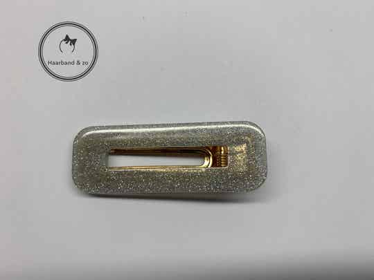 Grote haarclip, rechthoek, semi-transparant acryl met glittertjes. lichtgrijs (art.nr 111-06)