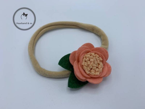 Nylon baby haarbandje met roze bloempje (art.nr. 79-01)