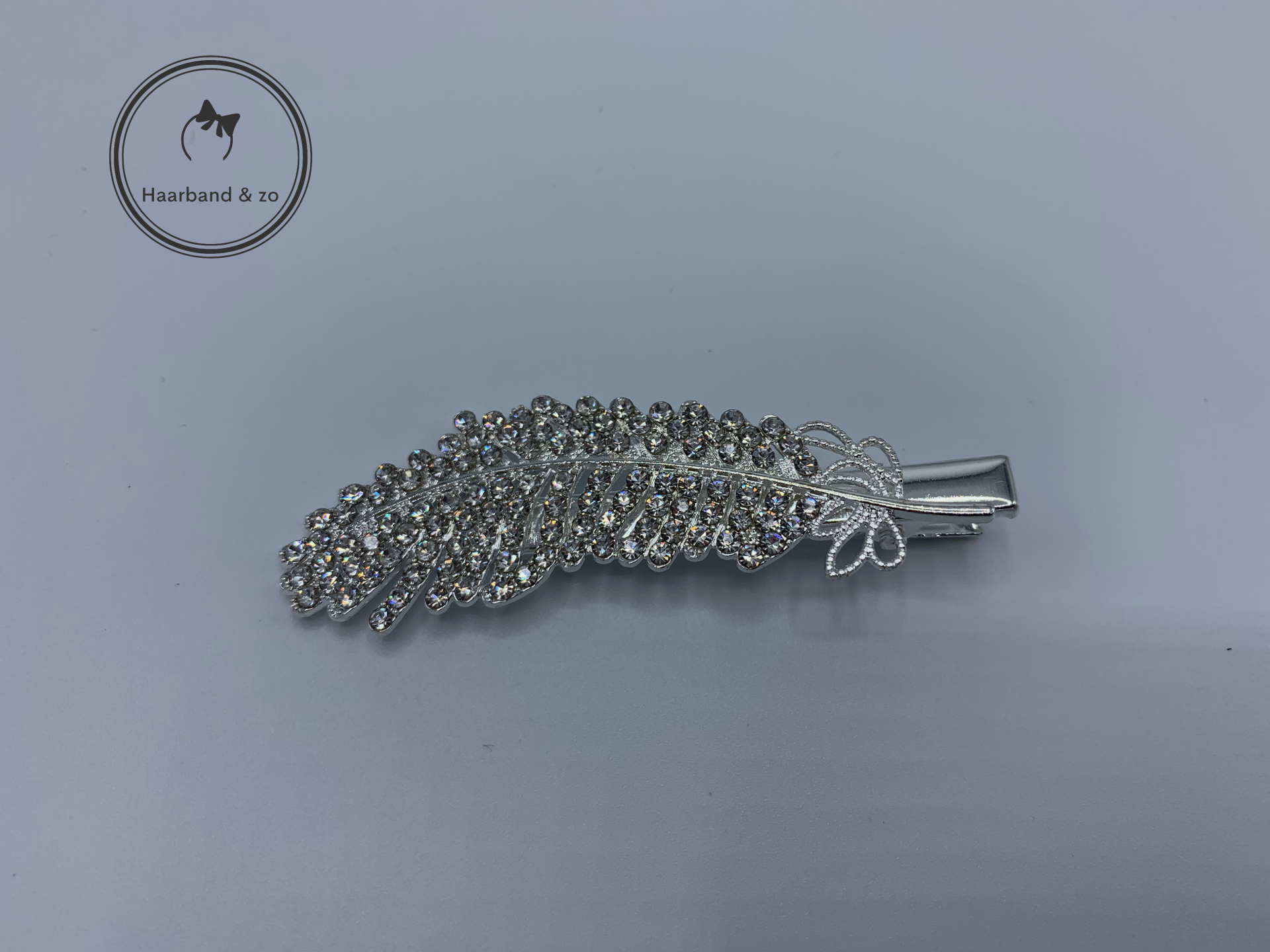 Haarspeld met clip, bladvormig met strass-steentjes, zilverkleurig (art.nr. 243-04)