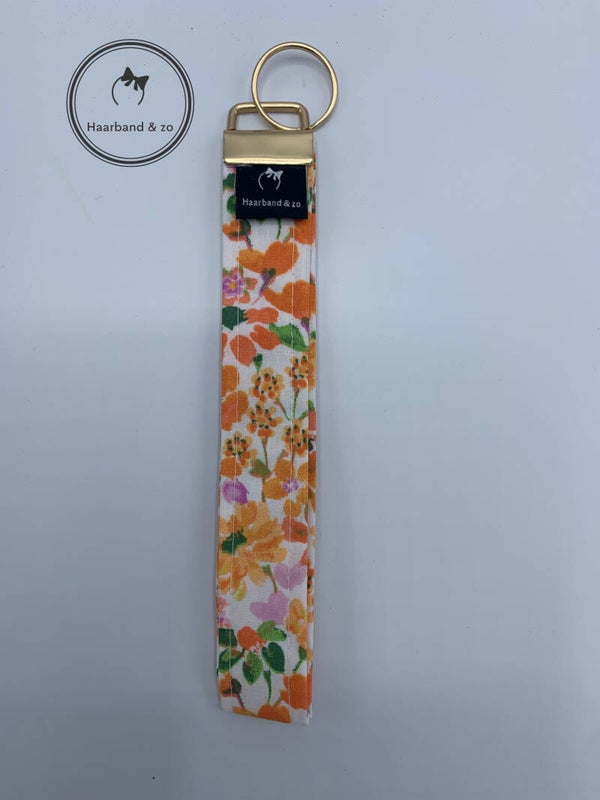 Haarband & zo, Sleutelhanger/Wristlet (polsband) smal, oranje bloemenprint (SH03-01)