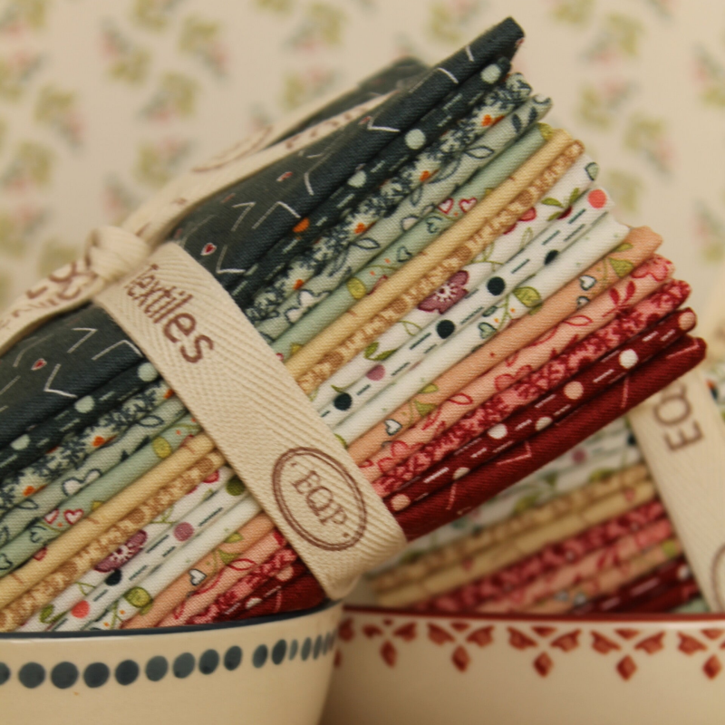 bundel fat quarters qultstoffen uit de serie new vintage, met een lintje van EQP