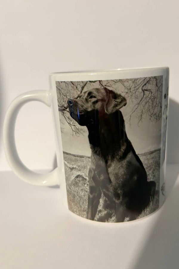 Black Labrador "Dogs leave paw prints on your heart" Mug