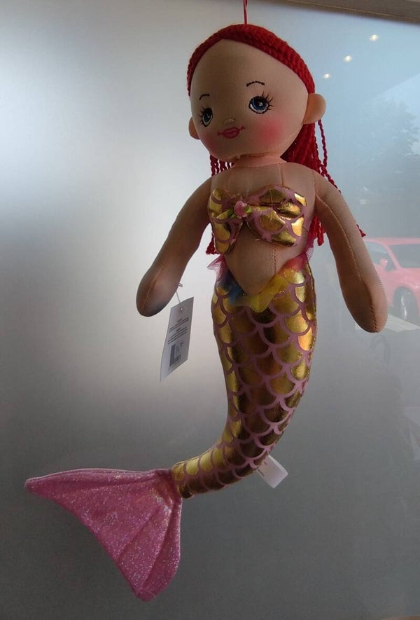 Zeemeermin met rose staart met stippen.