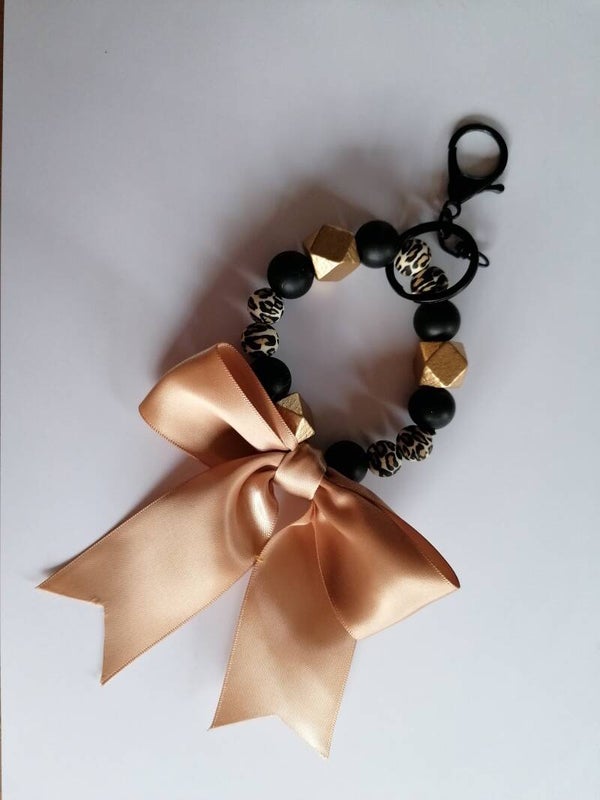 Sleutelhanger rond met gouden strik