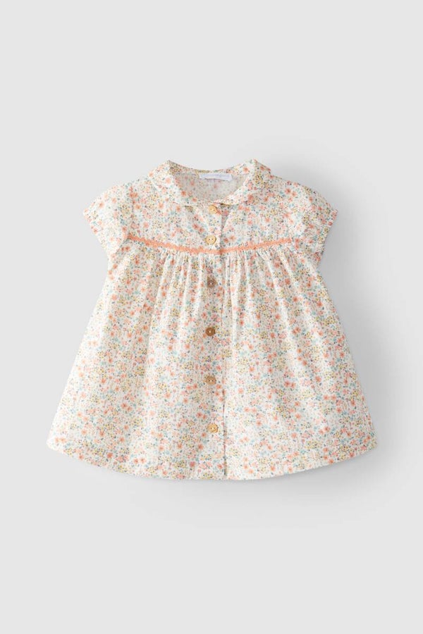 Laranijnha kleedje met kleine bloemetjes