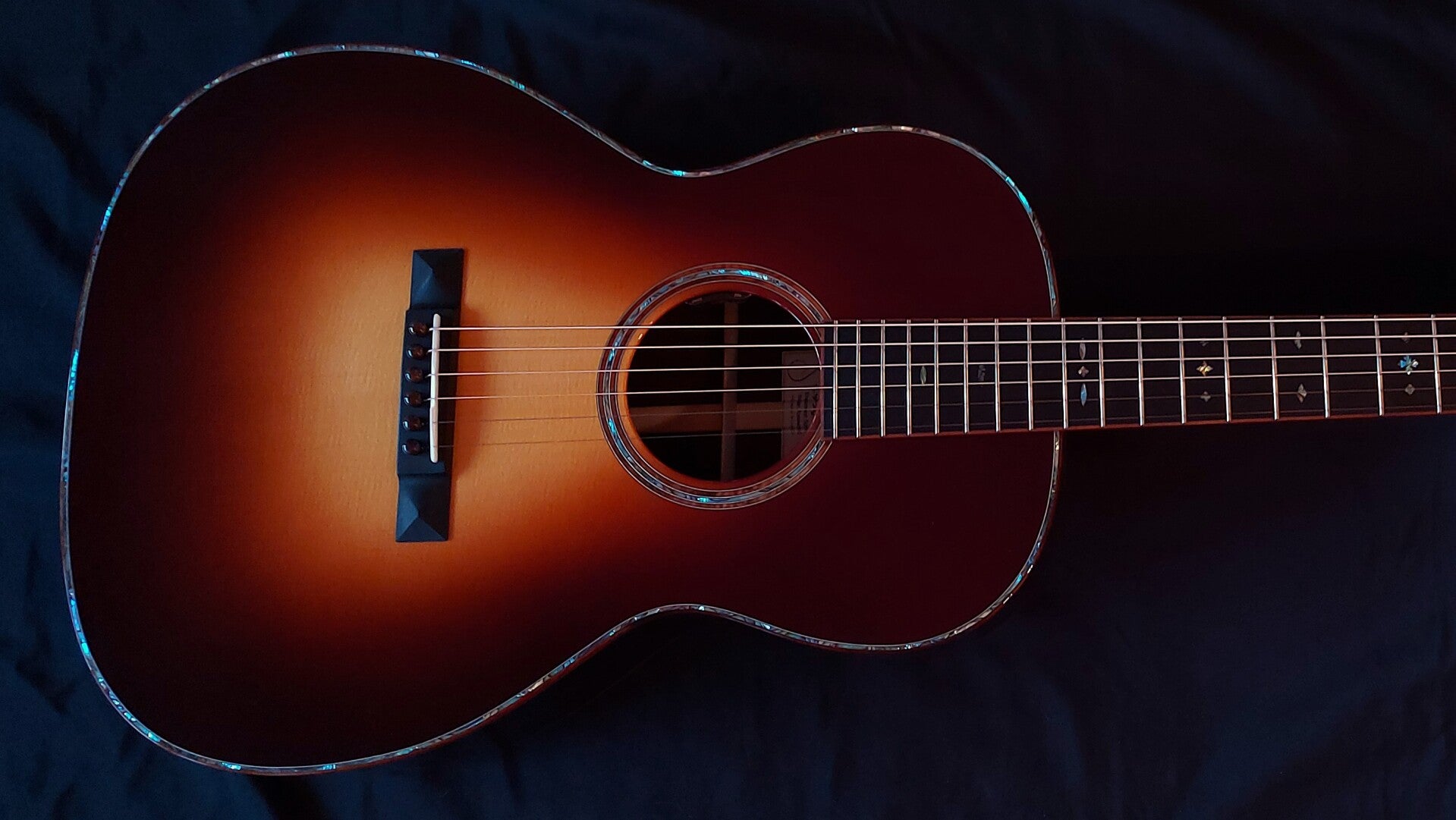 Northwood guitars 12 fret 000 acoustic guitar model with a beautiful sunburst finish and abalone rosette and purfling