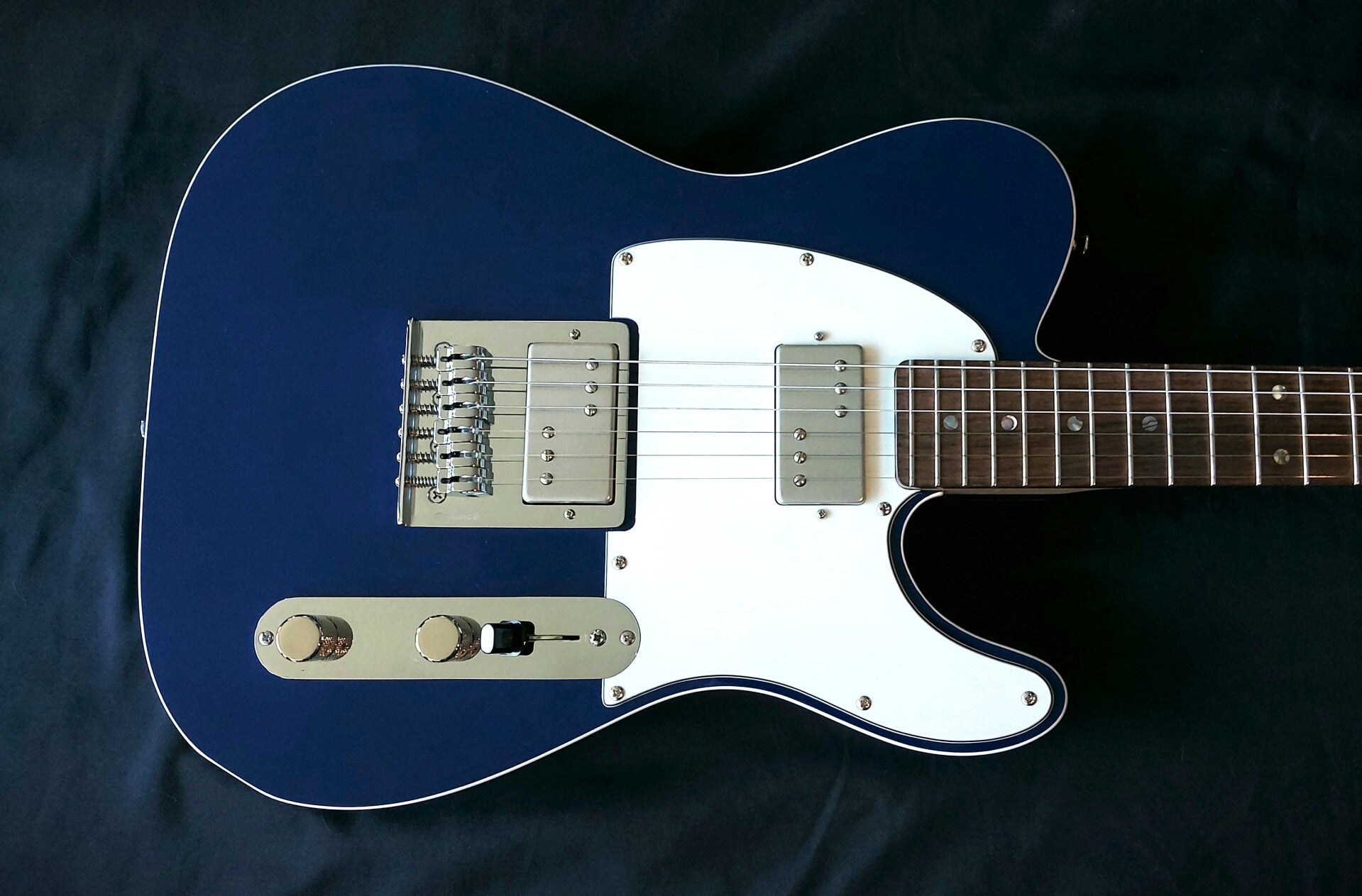 Custom Northwood T style electric guitar in Lake placid Blue with white pickguard and binding