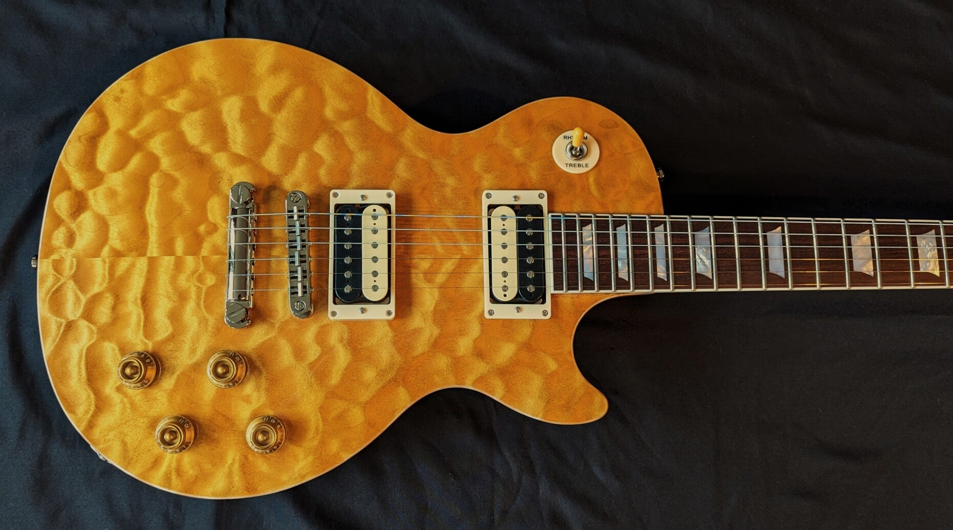 Northwood Guitars single-cut with 5A Quilted Maple carved-top, zebra pickups and mother of pearl trapezoid inlays