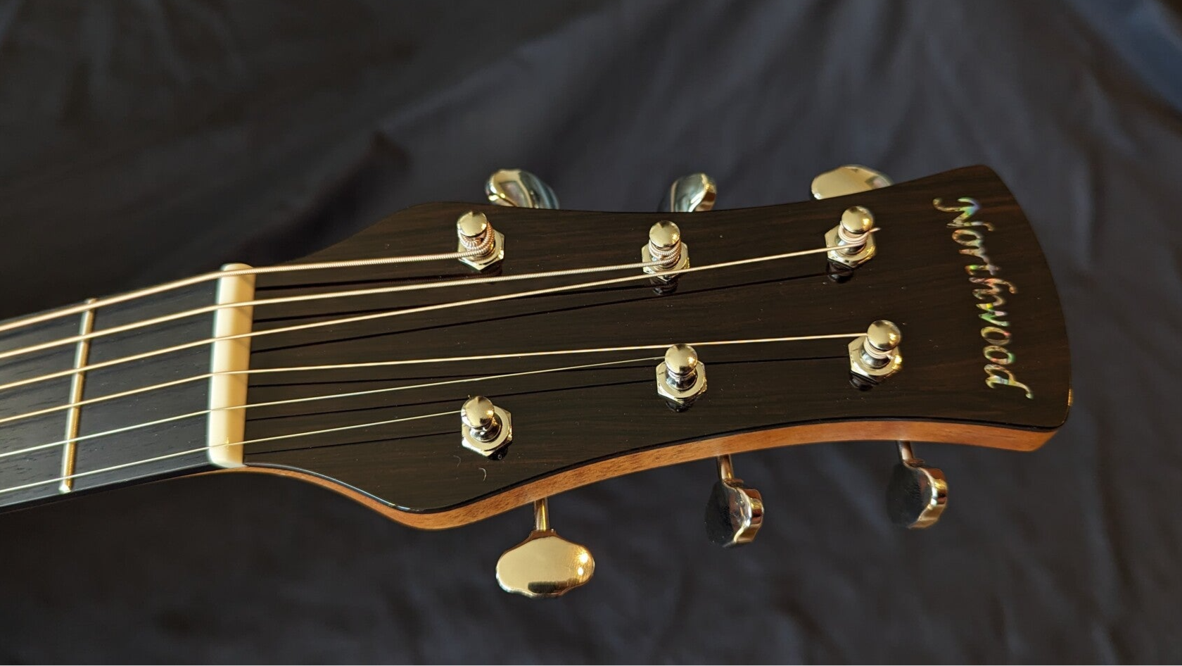 Northwood guitars 70 series paddle headstock with standard Grover 18:1 Sta-tite tuners and absalone Northwood logo.