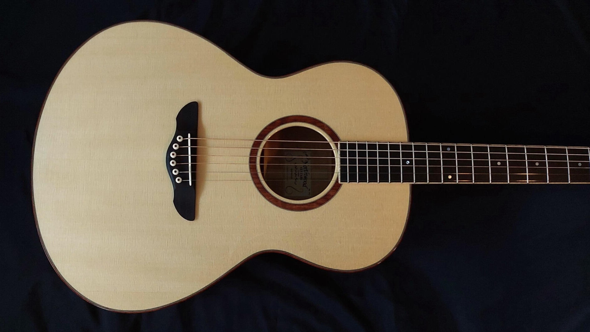 Northwood guitars Auditorium model acoustic guitar with flamed maple back and sides, engelmann spruce top and bubinga rosette and binding.