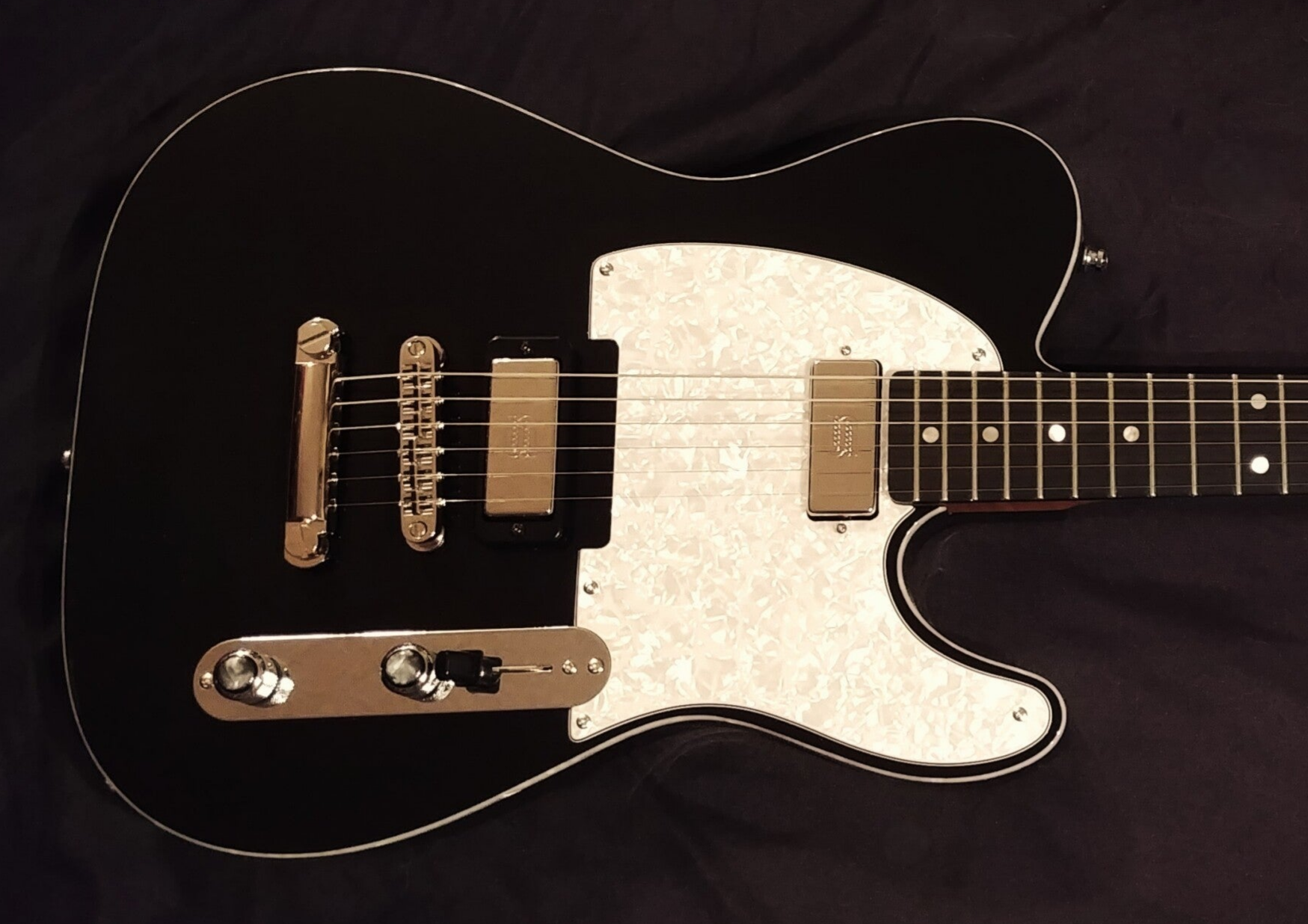 Custom Northwood T style electric guitar in black with pearloid pickguard, stoptail and tune-o-matic and mini humbucking pickups