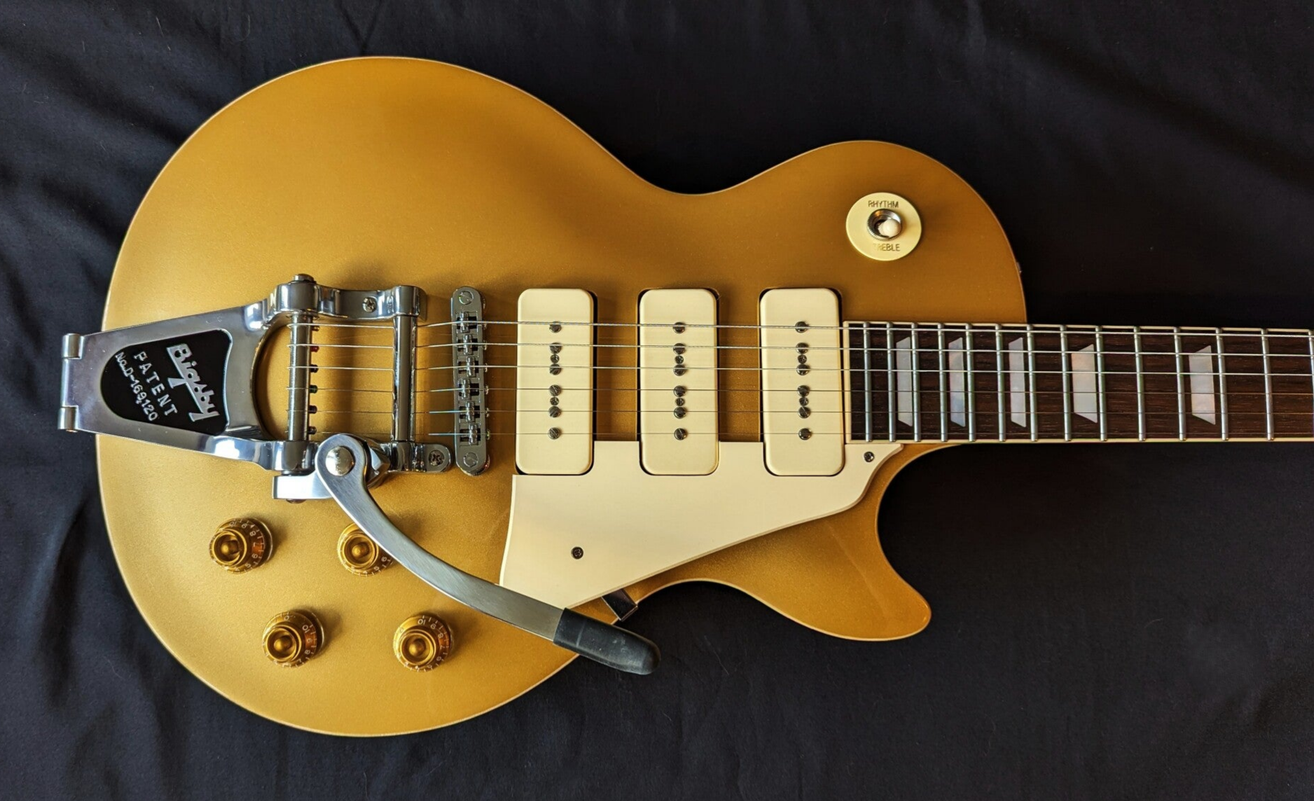 Northwood Guitars single-cut gold top with 3 stacked p 90 pickups, hand carved maple cap and Bigsby tremolo
